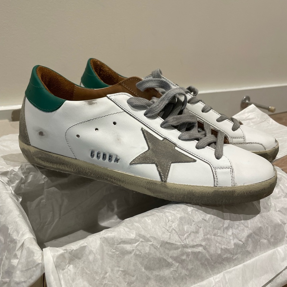 Women’s Golden Goose Super-Star sneakers with suede star and green heel tab